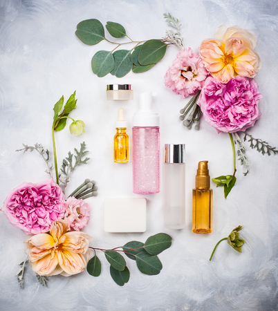 Set of skin care product and flowers. Top view.の写真素材