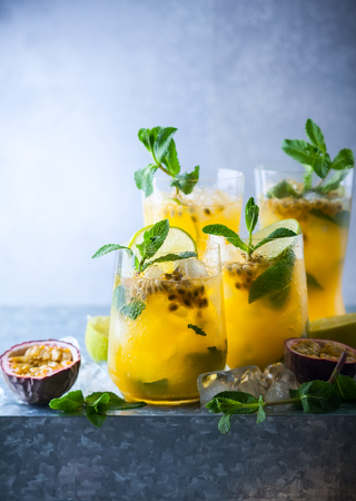 Passion fruit lemonade garnished with lime and mintの写真素材