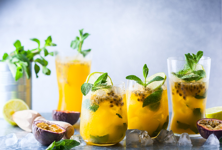 Passion fruit lemonade garnished with lime and mintの写真素材