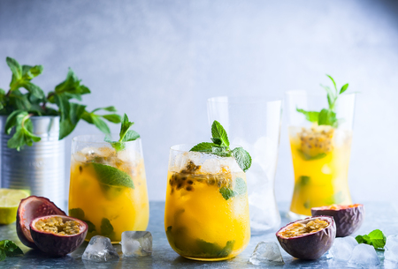 Passion fruit lemonade garnished with lime and mintの写真素材