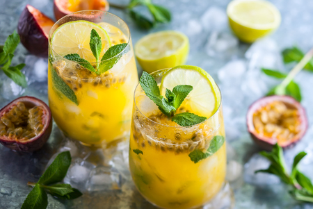 Passion fruit lemonade garnished with lime and mintの写真素材