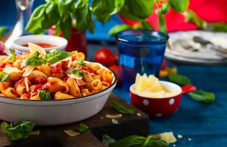 Pasta with spicy tomato sauce, parmesan and basil. Pasta Chifferi Rigati.の写真素材
