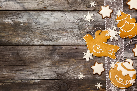 Christmas concept with cookies in rustic style on wooden background. Top view.の写真素材