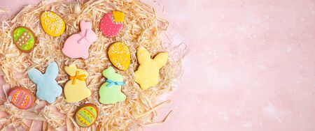 Colorful Easter homemade gingerbread cookies in shape of eggs and bunny.の写真素材
