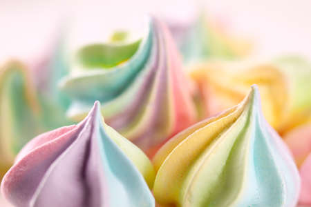 Closeup of sweet rainbow color and twisted meringue cookies. Concept of sweet food. Macro, soft focusの写真素材