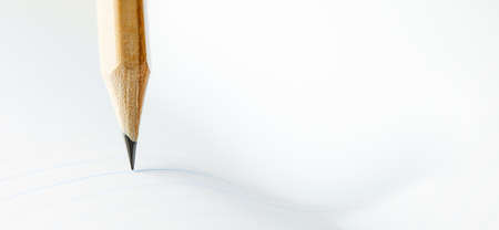 Closeup of sharp graphite pencil on white paper of notebook. Concept of The National Day of...