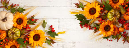Concept of fall harvest or Thanksgiving day. Autumn composition with pumpkins, wheat ears and...