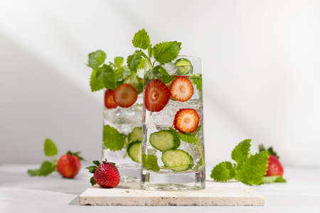 Summer detox drink. Strawberry, mint and cucumber refreshing water.の写真素材