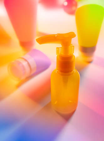 Colorful Cosmetic package collection on abstract spectrum neonの写真素材