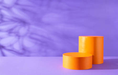 Halloween holiday concept. Orange Podiums or pedestals for products display on purple background.の写真素材