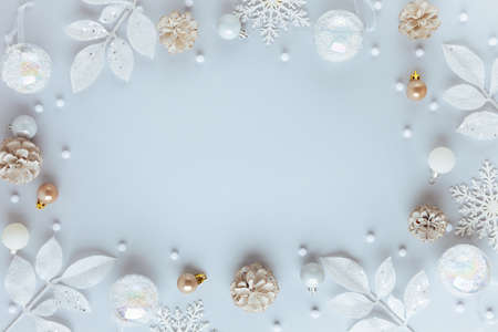Christmas and New Year holidays frame. Christmas ornaments on light pastel background. Flat lay, copy space.の写真素材