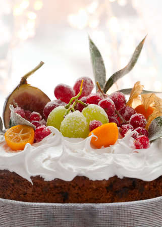 Traditional Christmas fruit cake with white frosting and sugared fruitsの写真素材