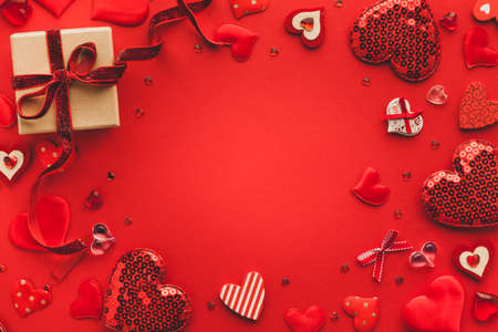 Valentine's day or Wedding romantic concept with Red hearts on red background. Top view, copy spaceの写真素材