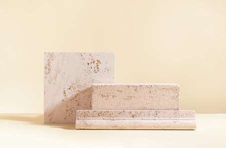Abstract modern still life. natural materials. Composition of travertine and concrete blocks.の写真素材