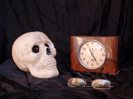 skull and old clockの写真素材