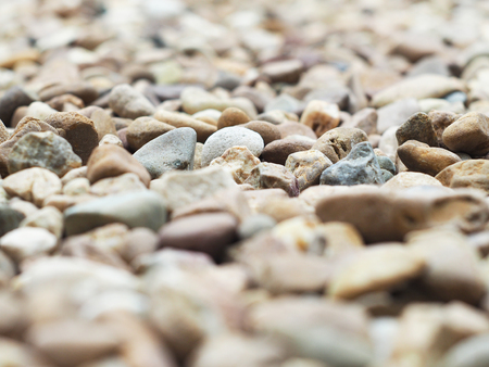 Stone wall texture photo, stone background , stone floor texture, white stone floor in the garden, white stone wall texture,white stones in the park. Zen stone on beach for perfect meditation.の写真素材