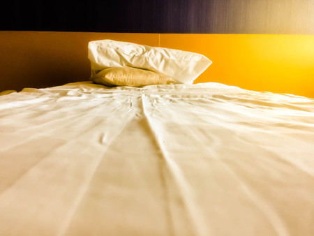 wrinkled bed sheet and Pillow at bedroom.の写真素材