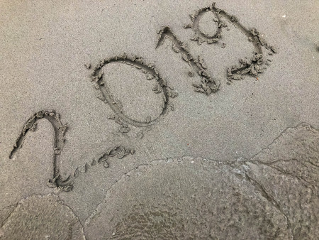Text 2019 on the beach,sand and sea,new years concept.