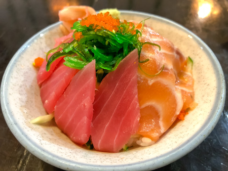 Raw salmon and Seaweed with rice,Sashimi Donburiの写真素材