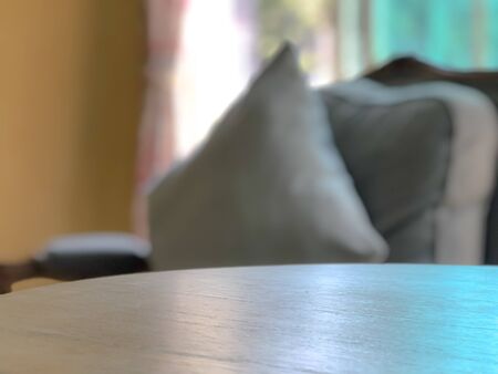 Eempty table with blurred pillow and window.の写真素材