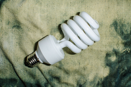 a light bulb on rough denimsの写真素材