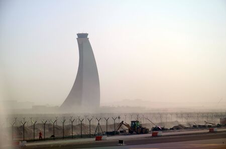 Abu Dhabi airport control tower in sandy weather