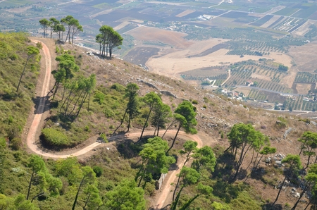 view of a serpentine road on the hillside in Erice town in Sicily, Italyの写真素材