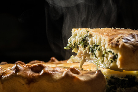 Slice of spinach pie. Closeup.の写真素材