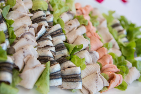 Delicious appetizer canapes on board for celebratory tableの写真素材