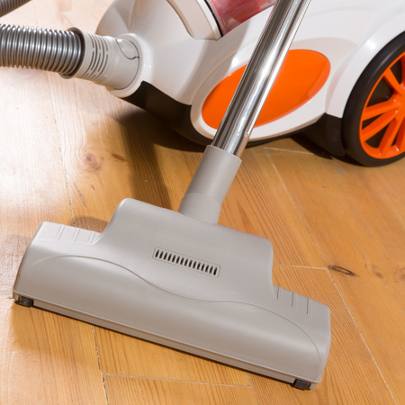 vacuum cleaner stands in the home. livingroomの写真素材