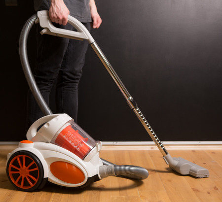 man who cleans the floor of the houseの写真素材