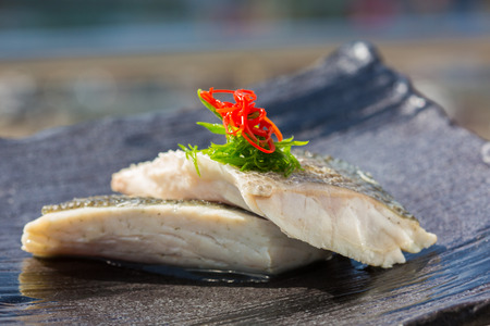 steamed organic fish fillet at restaurantの写真素材