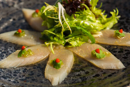 organic white tuna meat sliced at plate with saladの写真素材