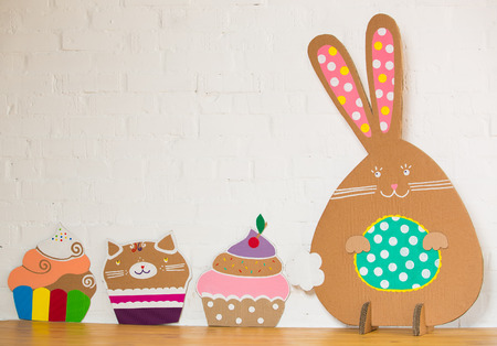 Rabbit made ââfrom organic paper on a white wall. Decoration.の写真素材