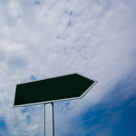 Blank signpost over blue sky - just add your text.の写真素材