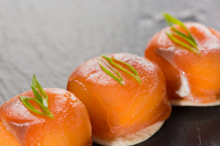 Canapes with smoked salmon and cream cheese. Close-up