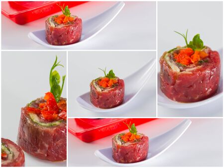 tasty appetizer. Beef carpaccio with salad leaves and vegetabales. の写真素材
