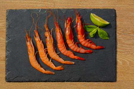 Organic Tiger shrimps on black stone background. Close upの写真素材