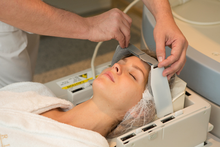 doctor examining woman at Magnetic resonance imaging