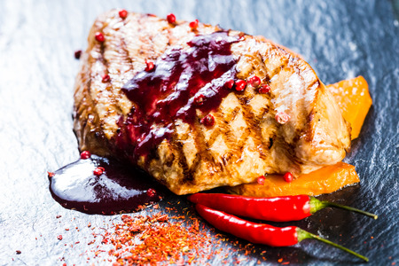 Deer steak with cranberries sauce. Selective focus.の写真素材