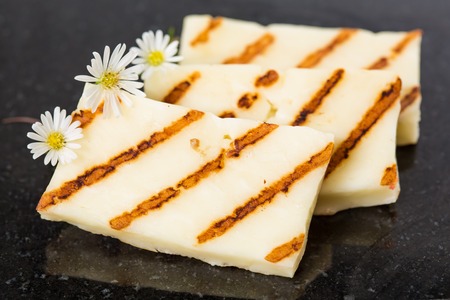 Halloumi cheese frying in grill pan. Closeupの写真素材
