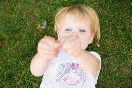 Outdoor portrait  of cute little girl in summer dayの写真素材