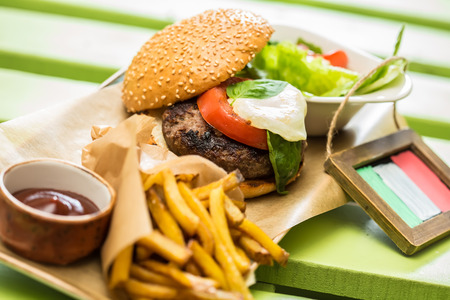 Delicious burger with beef, tomato, lettuce and fries. selective focusの写真素材