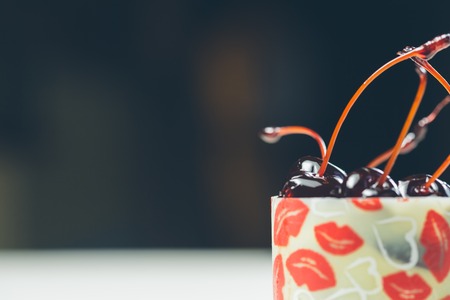 vanilla dessert with cherry confiture. Warm colors. Shallow dof.