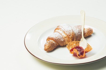 breakfast with croissant. Warm colors. Shallow dof.の写真素材