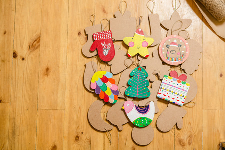 Cardboard toys for the Christmas tree or Christmas garland. Christmas decorations. Selective Focusの写真素材