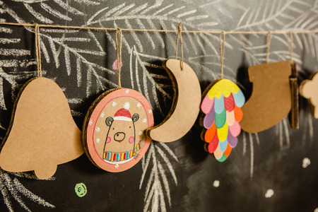 Cardboard toys for the Christmas tree or Christmas garland. Christmas decorations. Selective Focusの写真素材