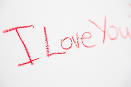 Handwritten simple words. I love You. On white paper. Creative cardの写真素材