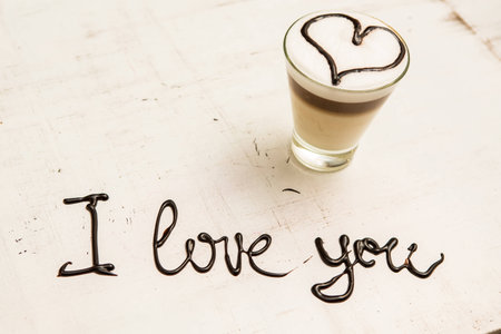 Love coffee cup and handwriting. I love you. Creative cardの写真素材