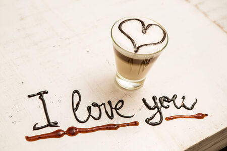 Love coffee cup and handwriting. I love you. Creative cardの写真素材
